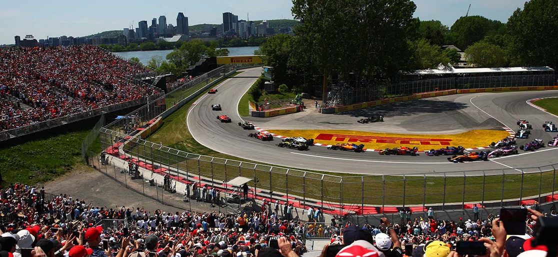 Sebastian Vettel leads Lewis Hamilton out of turn 2 at the start of the 2019 Canadian F1 Grand Prix