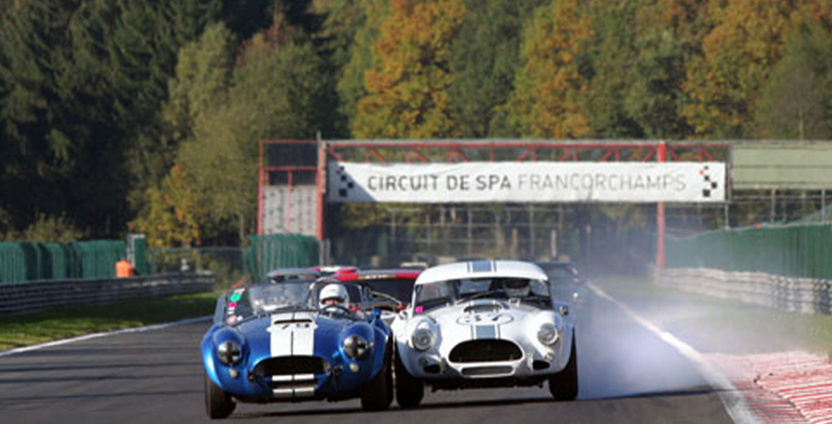 Classic cars race along the Kemmel Straight at the Spa-Francorchamps circuit