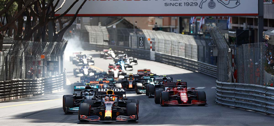 Max Verstappen leads for Red Bull Racing into turn 1 at the 2021 Monaco Grand Prix